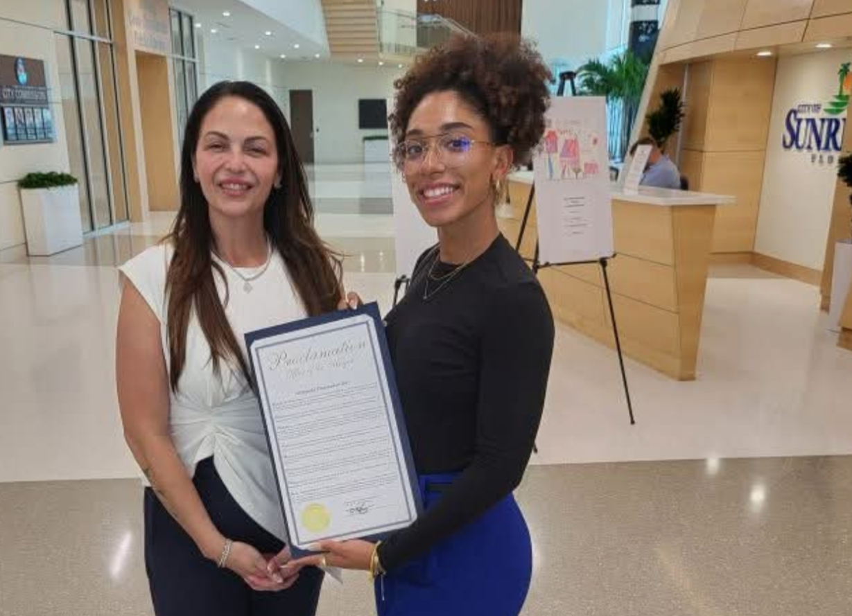 Niccole Pazos with a community member at Sunrise City Hall